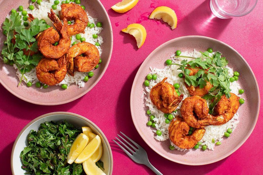 Spicy jumbo shrimp tikka masala with basmati rice, peas, and chard