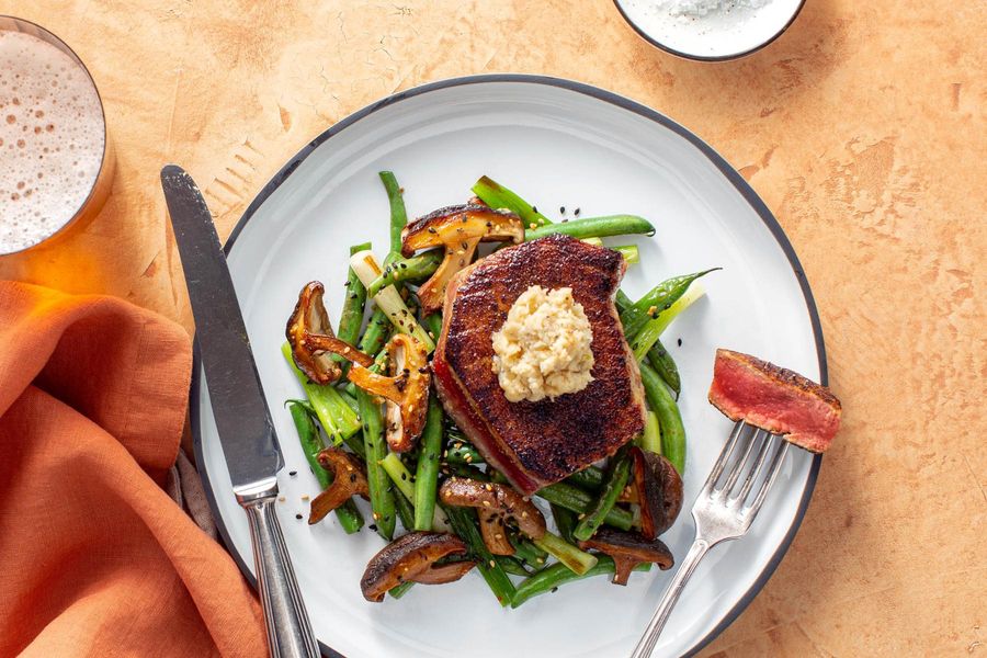Seared tuna with roasted garlic–miso butter, green beans, and shiitakes