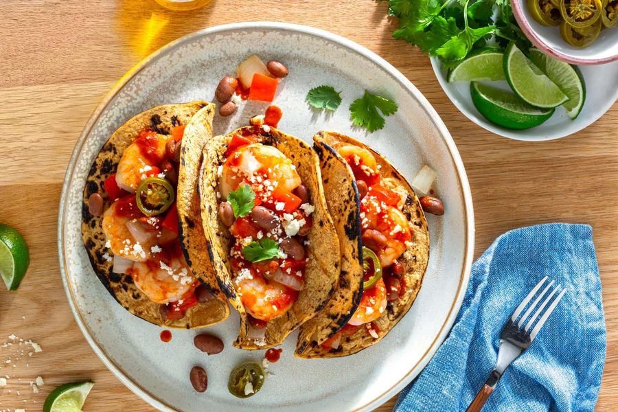 Shrimp diablo tacos with bell peppers and queso fresco