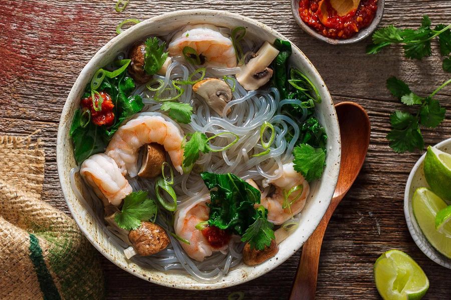 Lemongrass shrimp soup with mushrooms, kale, and glass noodles