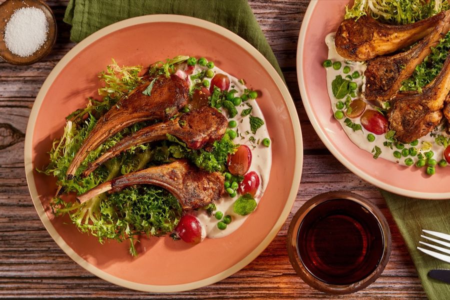 Harissa lamb chops with chicory-grape salad and lemon-tahini yogurt