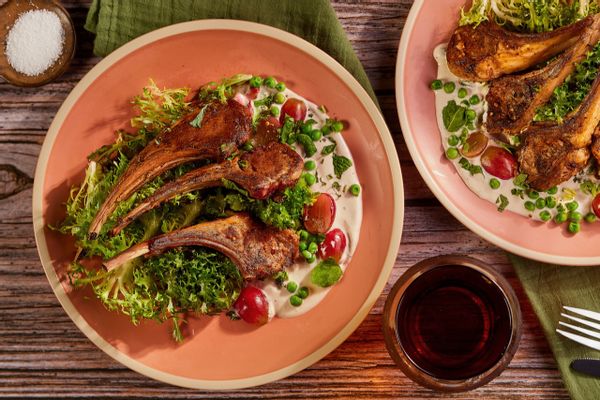 Harissa lamb chops with chicory-grape salad and lemon-tahini yogurt