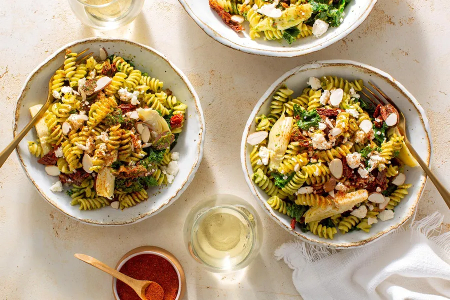 Fresh fusilli with kale, artichokes, and feta