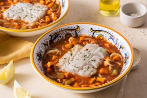 Poached cod in tomato broth with sweet potato and golden raisins