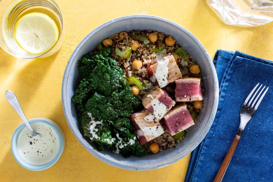 Quinoa bowls with wilted greens and citrus dressing