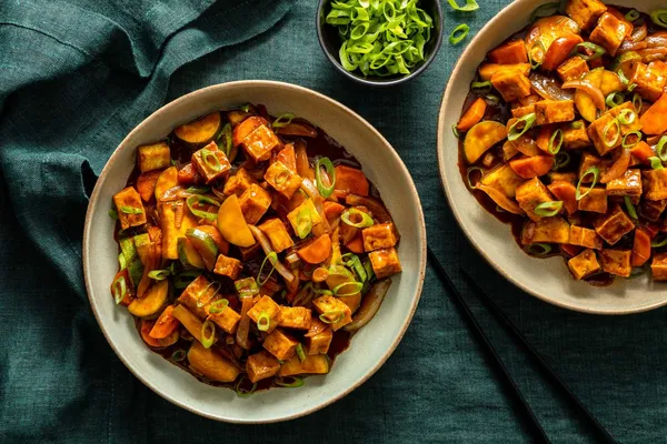 Steak and vegetable stir-fry with cashew-plum sauce