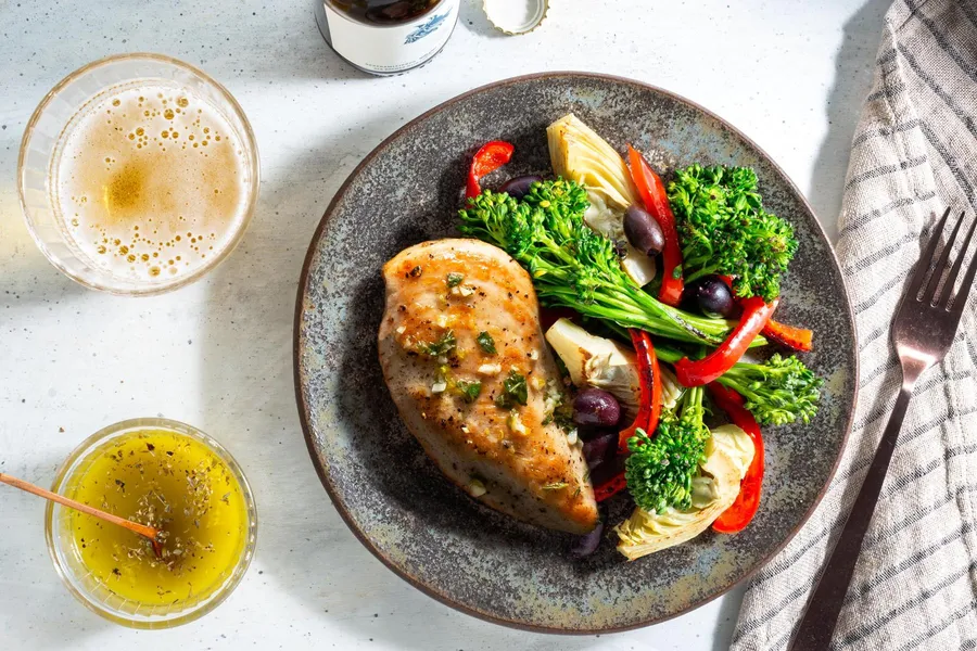 Mediterranean lemon chicken with baby broccoli, artichokes, and olives