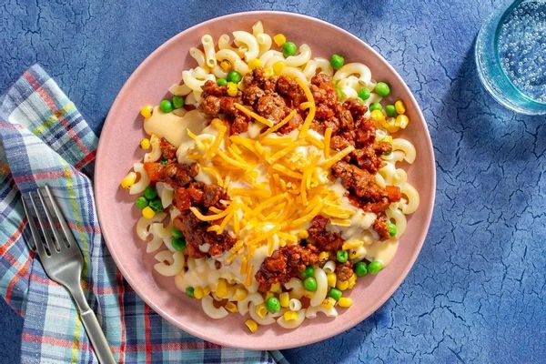 Sloppy joe and cheesy macaroni bake with corn and sweet peas