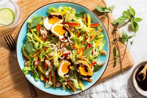 Son-in-law eggs over Thai mango salad