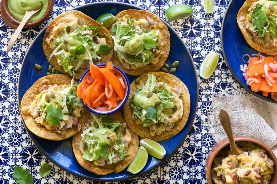 Tex-Mex tostadas with pickled carrots and avocado crema