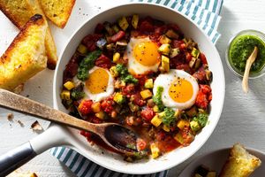 Spanish pisto con huevos with tomatoes, eggplant, and garlic bread