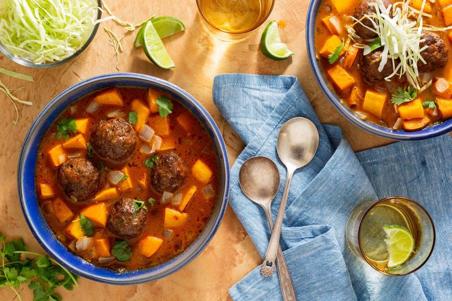 Spicy Mexican meatball soup with butternut squash, cabbage, and cilantro