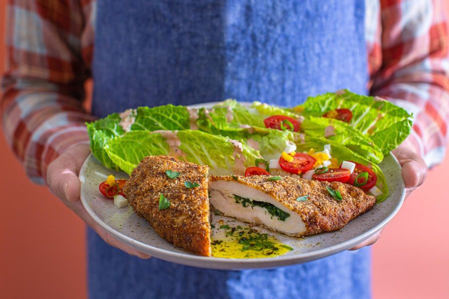 Chicken Kiev and romaine salad with hard-cooked eggs and Russian dressing