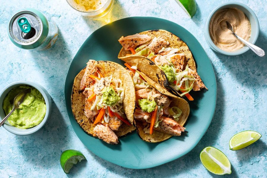 Salmon tacos with cabbage slaw, guacamole, and chipotle yogurt