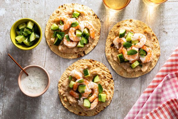 Lamb flatbread “tacos” with white bean mash and cucumber-mint relish