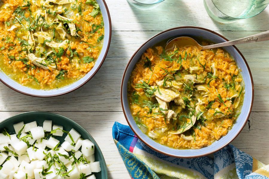 Chicken chile verde over paprika rice with jicama salad