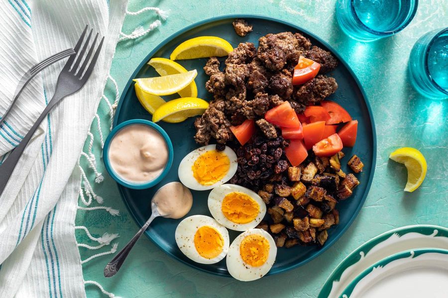 Mediterranean meze platter with lamb, eggplant, and hard-cooked eggs