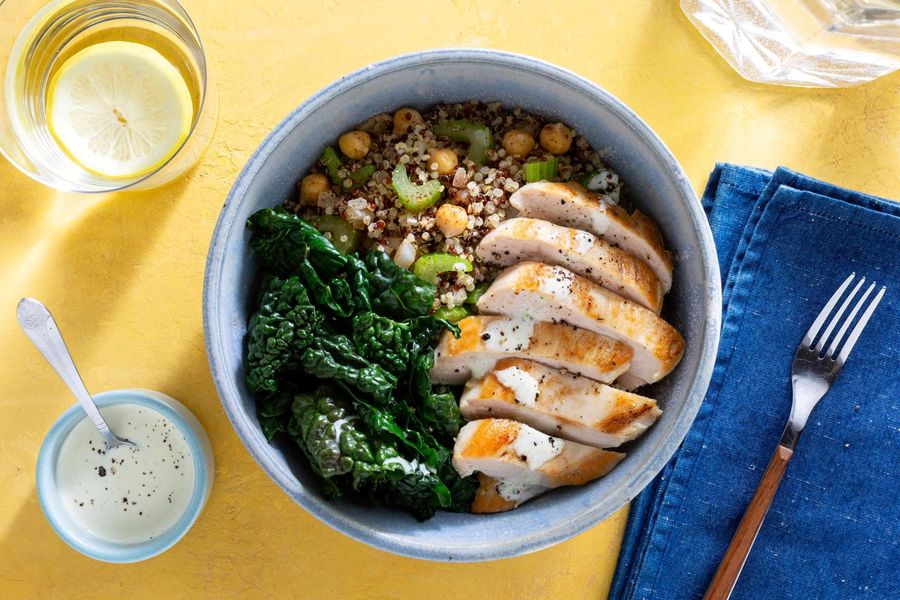 Quinoa bowls with wilted greens and citrus dressing