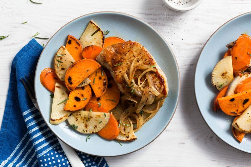 Pork with caramelized onion and rosemary-roasted root vegetables ...