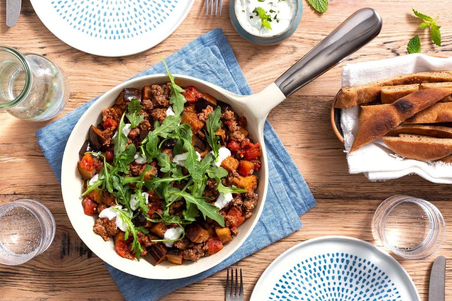 Lamb moussaka skillet with eggplant and toasted flatbread