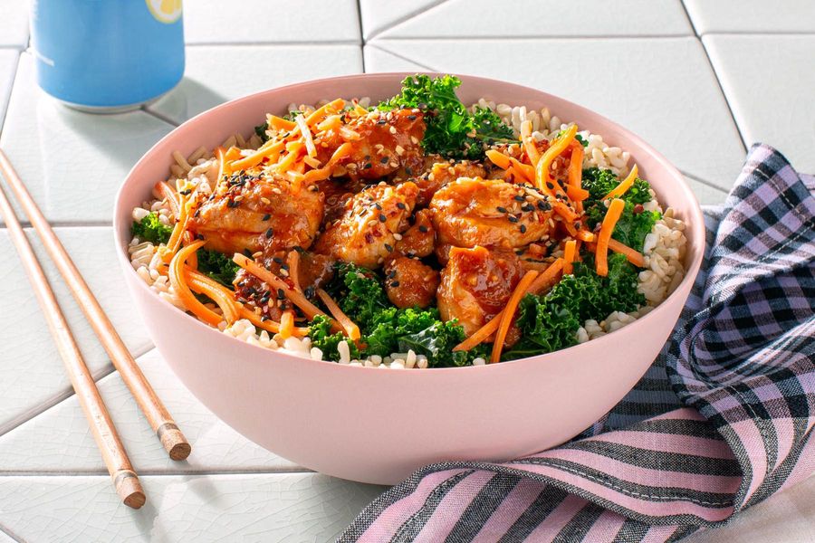 Korean sweet and sour chicken bowl with brown rice, kale, and carrots
