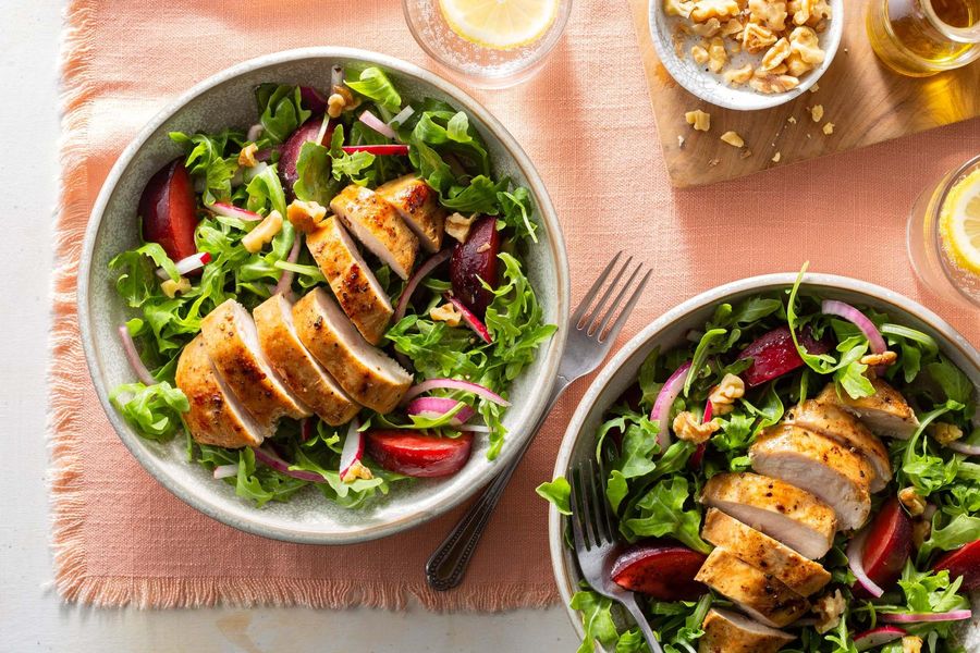 Summer chicken salad with charred plum, arugula, and walnuts