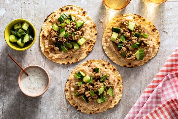 Lamb flatbread “tacos” with white bean mash and cucumber-mint relish