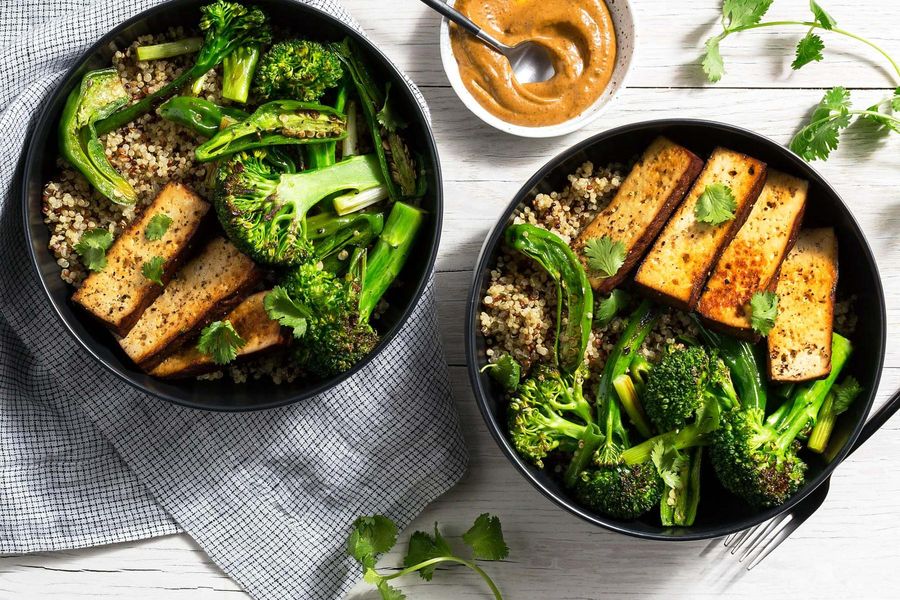 Braised tofu bowls with quinoa, baby broccoli, and shishito peppers
