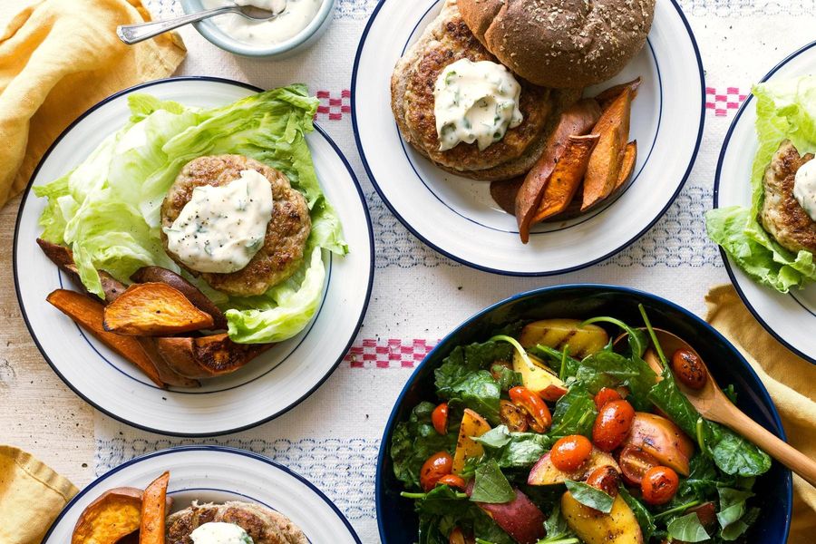 Lettuce-wrapped turkey burgers with grilled peach salad and basil mayo