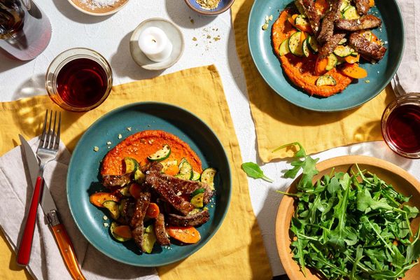 Top sirloin steak strips with zucchini, romesco, and pumpkin seed dukkah