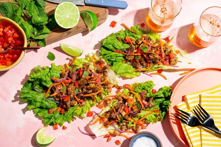 Larb lettuce cups with carrots, tomato, and fresh mint