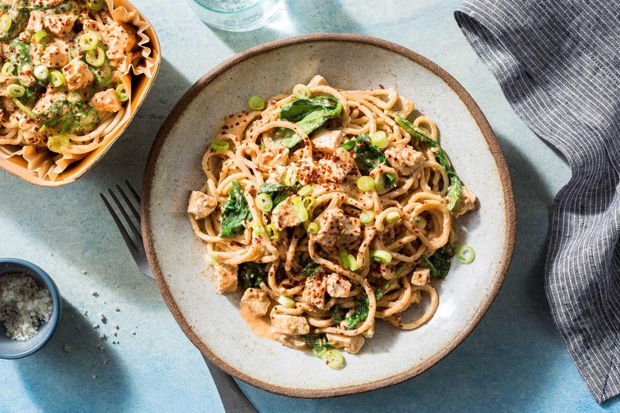 Spicy Sichuan dan dan noodles with tofu and spinach