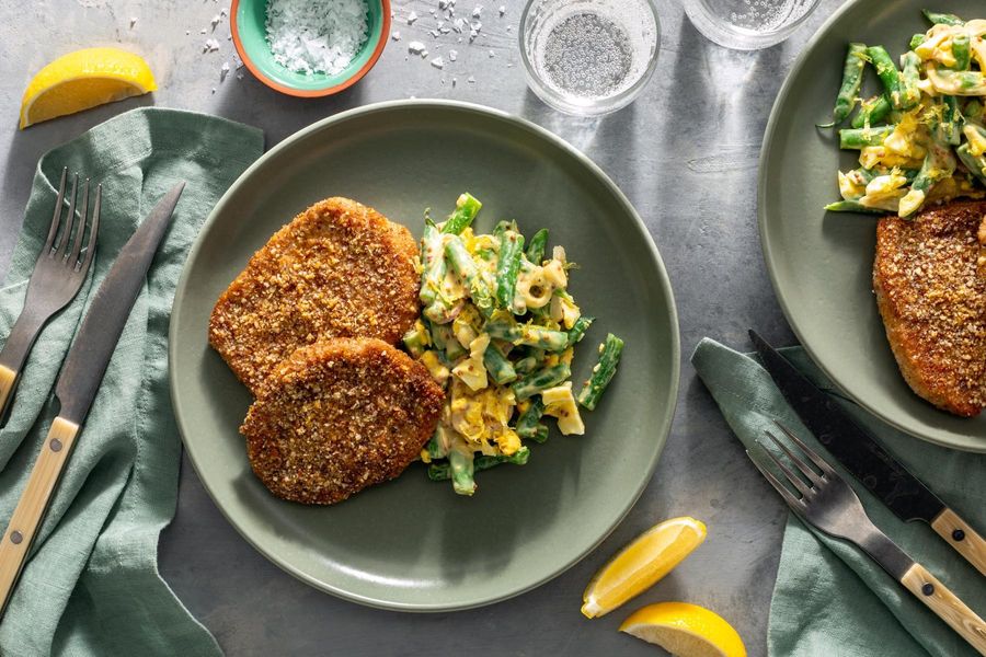 ​​Pork schnitzel with lemony green bean and egg salad