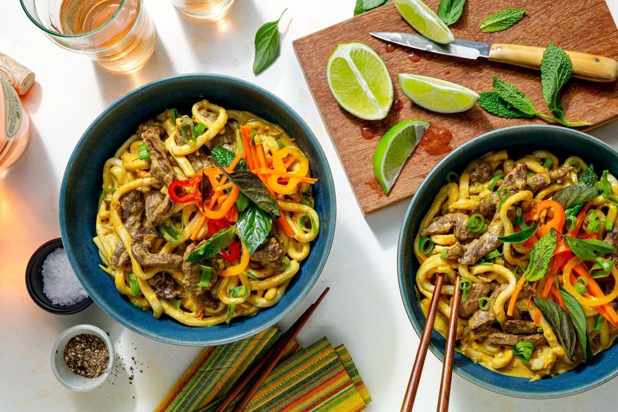 Pork cashew curry with udon and fresh herb salad