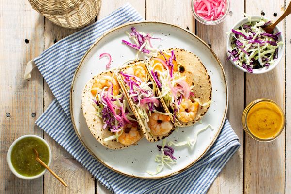 Mojo pork tacos with pickled onions and salsa verde