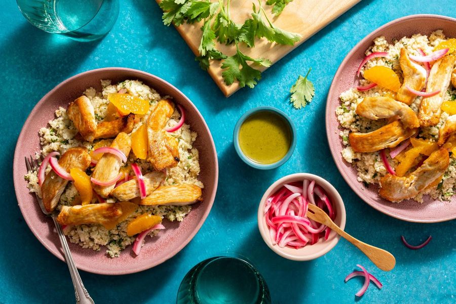 Peruvian chicken over orange–cauliflower “rice” with ají verde