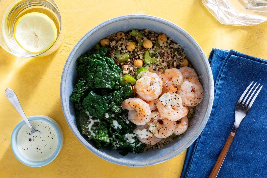 Quinoa bowls with wilted greens and citrus dressing
