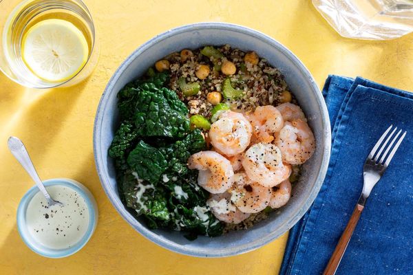 Salmon and quinoa bowls with wilted greens and citrus dressing