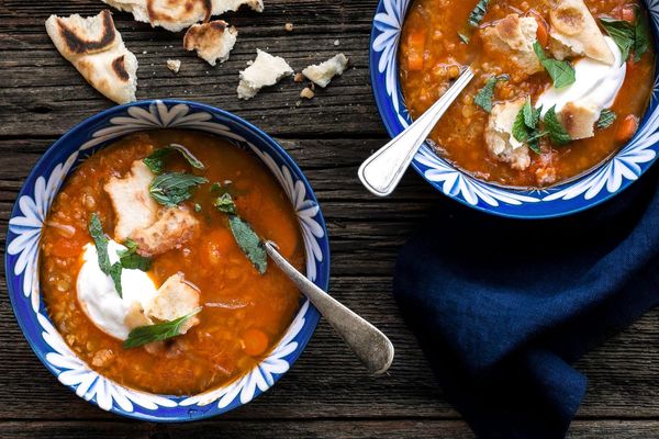 Turkish red lentil soup with yogurt and naan croutons
