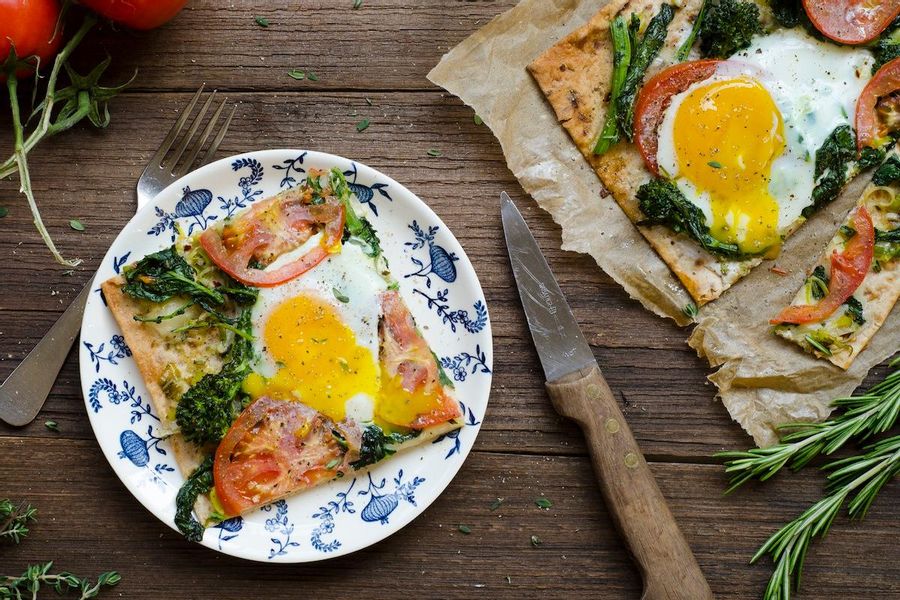 Leek and broccoli rabe flatbread with a fried egg