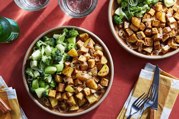 Mole-spiced beef and potatoes with broccoli and green romesco salad