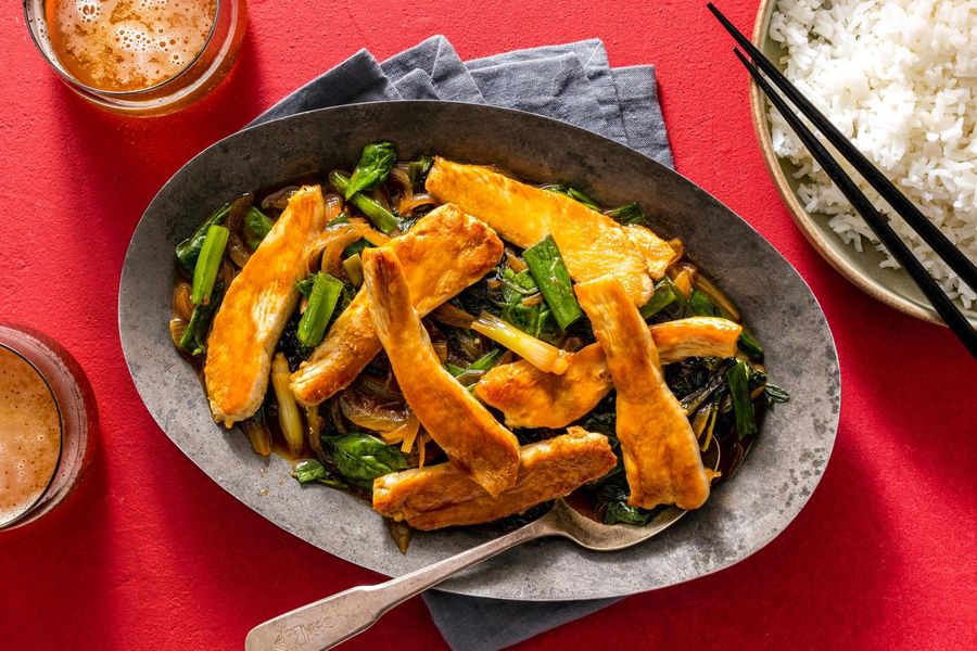Mongolian stir-fry with spinach and scallions over steamed rice
