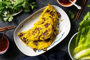 Vietnamese banh xeo crepes with pork and nuoc cham dipping sauce