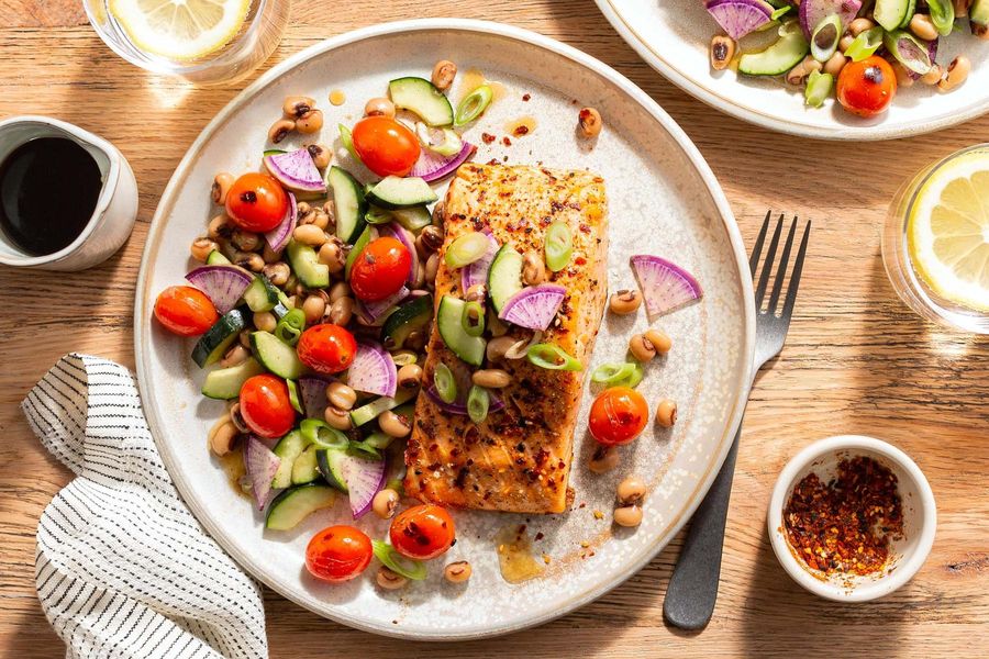 Shichimi-spiced salmon with blistered tomato and black-eyed pea salad