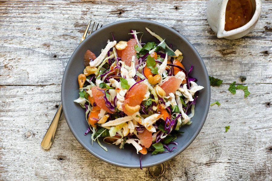 Shredded chicken and cabbage salad with grapefruit and toasted cashews