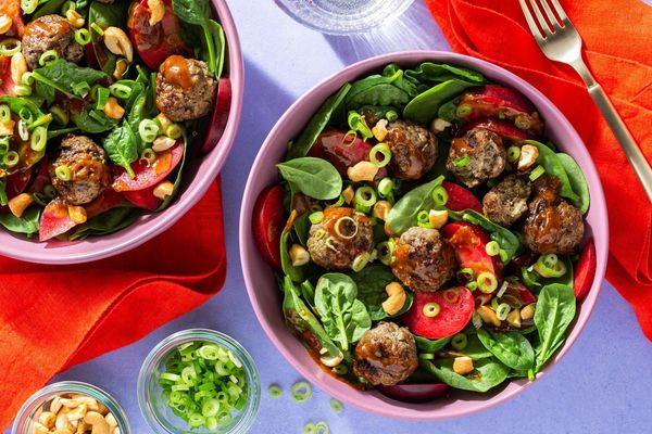 Lemongrass chicken meatballs with spinach-plum salad and cashews