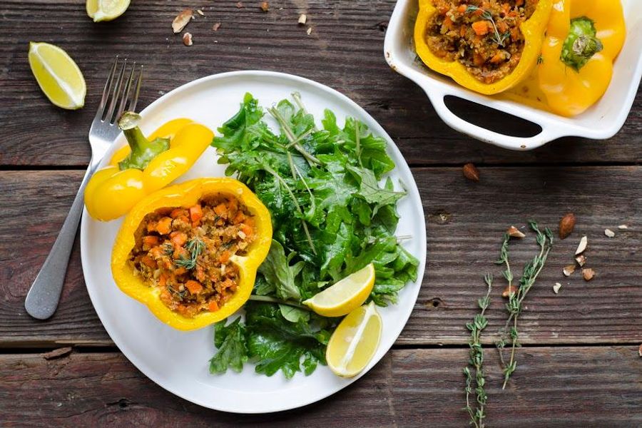 Almond-stuffed bell peppers and baby kale salad