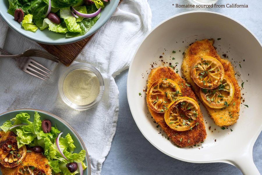 Chicken Milanese with charred lemon and insalata romana