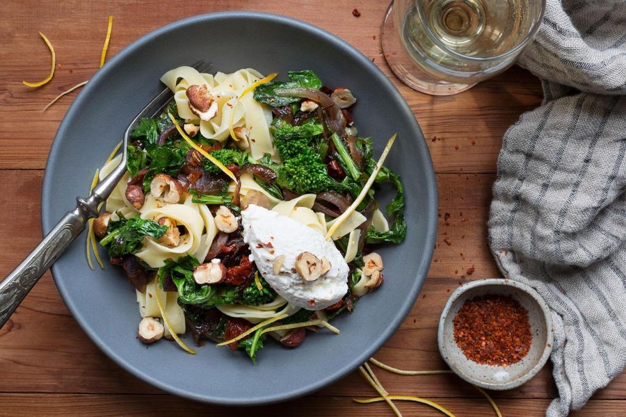 Tagliatelle with broccoli rabe, sun-dried tomatoes, hazelnuts, and ricotta