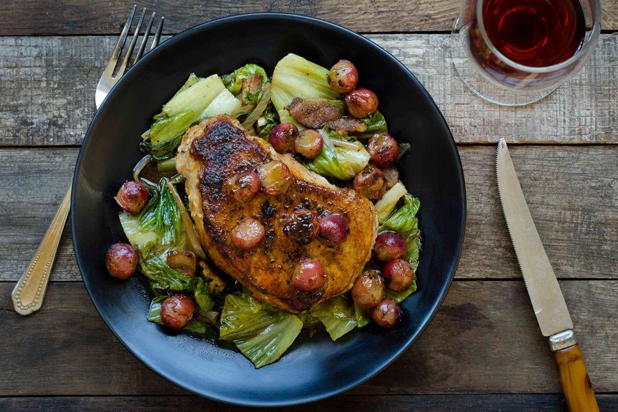 Pork with bacon-braised escarole and charred grapes